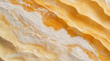 Abstract waves of orange and white create a captivating textured landscape. The colors blend smoothly, forming organic patterns. photo