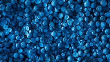 Intense view of tightly packed, vibrant blue spheres fills frame, creating an abstract and visually engaging texture and dynamic pattern. photo