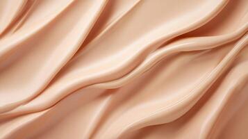 A textured surface with flowing, pale beige waves, creating a smooth and creamy aesthetic, suitable for artistic or cosmetic purposes. photo