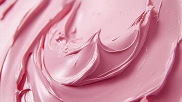 Close-up of a swirl of creamy, light pink substance, possibly icing or a similar material, smooth texture and soft color palette. photo