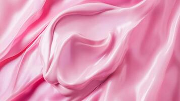 Silky waves of pastel pink fabric create a luxurious and elegant texture, soft surface, subtle folds, and light reflections. photo