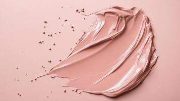 Smooth textured cosmetic foundation stroke on matching background. Minimalist studio shot of makeup swatch. Isolated image. photo