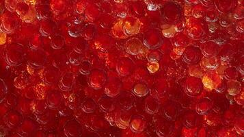 Abstract image of glossy red and golden spheres that reflect light and shadows creating a mesmerizing textured vibrant background. photo