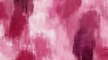 Abstract strokes of pink paint blend to form an evocative texture, a play of light and shadow across a textured background. photo