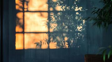 Intimate scene of shadows dancing on a wall, where nature's leaves and window panes create a captivating, warm light play. photo