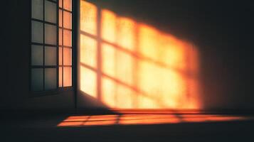Warm sunlight streams through a paneled window, casting linear shadows across the room. The light illuminates the wall and floor. photo
