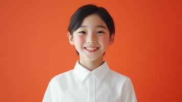 Portrait of a young individual with a warm smile, set against a vibrant orange backdrop, radiating joy and approachability. Clean, simple, and engaging. photo