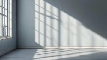 A sun-drenched room with walls bathed in a soft light creates a calming, inviting atmosphere. The window casts shadows on the wall. photo