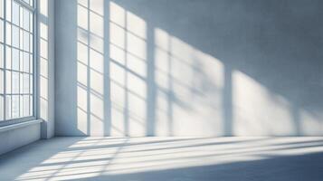 Empty room filled with natural light from window. Bright shadows on the wall and floor creating patterns and a modern feel. photo