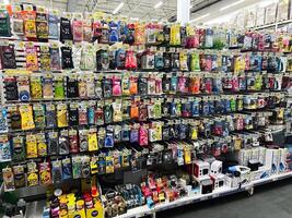 Lviv, Ukraine - February 16, 2025 Wide selection of colorful automotive air fresheners displayed on store shelves photo