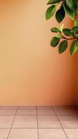 Orange Textured Wall with Green Leaves and Tiled Floor photo