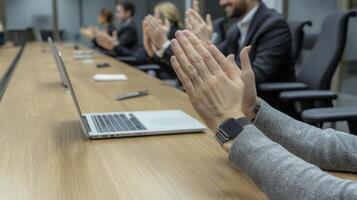 A Diverse Team Celebrating Success in the Modern Workplace Showcasing Collaboration, Applause, and Achievement Depicting Business Professionals Clapping at a Conference Table After a Successful photo