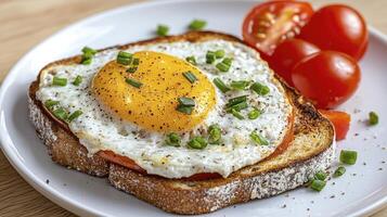 Delicious Breakfast Toast with Fried Egg and Cherry Tomatoes A Healthy and Nutritious Start to Your Day Enjoy this Simple and Quick Recipe Featuring a Perfectly Cooked Egg on Toasted Bread, Garnished photo