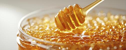 Golden Honeycomb Delight A Close-Up of Nature's Sweet Nectar, Dripping from a Honey Dipper into a Glass Jar, Showcasing the Rich Texture and Amber Color of Pure Honey, Perfect for Food Photography photo