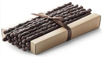 Indulge in Delectable Delights A Close-Up of Chocolate-Covered Pretzels, Perfect for Gifting or Personal Enjoyment These Crispy, Sweet Treats are Beautifully Arranged in an Elegant Box, Tied with a photo