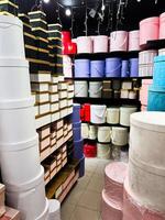 Stacked gift boxes of various shapes in a retail display setting photo