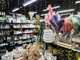Colorful floral and decorative items on display in a bright retail store photo