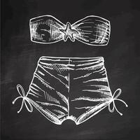 Hand drawn sketch of two-piece beachwear set with bandeau top and tied shorts in monochrome vintage style on chalkboard background vector