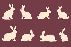 Set of Various silhouettes of rabbits on dark background vector