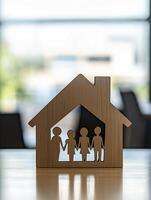 simple wooden house silhouette with cut out family figure symbolizes unity and warmth photo