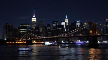 Night View of Manhattan Skyline Brooklyn Bridge and City Lights at Dusk photo
