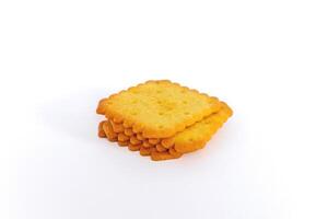 A stack of biscuit crackers in a square shape on a white background photo