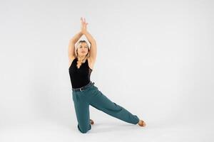 Dancer performing modern dance on white background. photo