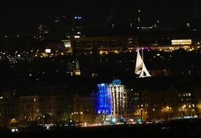 Illuminated Dancing house in Prague Czechia in February 2025 photo
