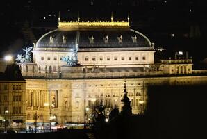 Illuminated National theatre in Prague during winter night in February 2025 photo