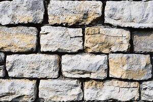A close up of a wall made of stone photo