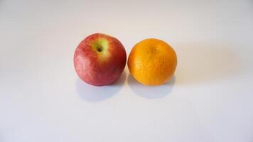 A red apple and an orange photo