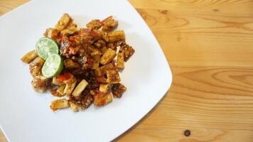 A plate of food with a lime wedge on it photo