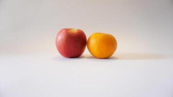 A red apple and an orange photo