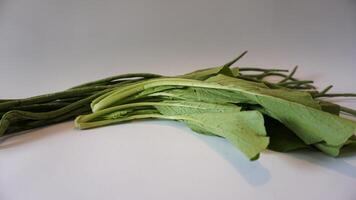 A bunch of green vegetables on a table photo