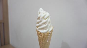 A white wall behind the cone photo