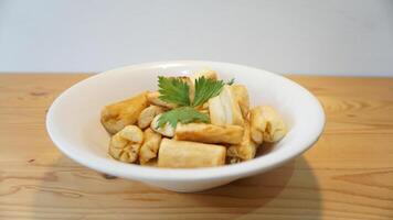 A bowl of food on a table photo