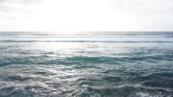 A person on a surfboard riding the waves photo