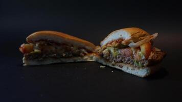 A close up of a sandwich with meat and vegetables photo