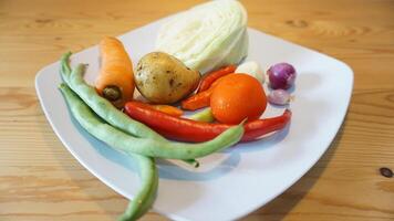 A white plate with vegetables on it photo