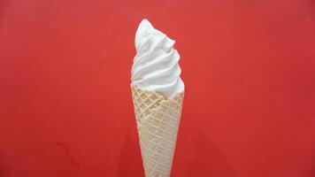 Ice cream cone on red background photo