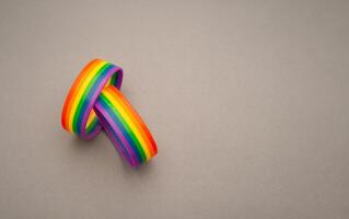 Rainbow patterned wristbands are on a gray background photo