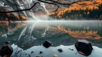Serene Lake Reflection of Mountains and Forest in Autumn Haze photo