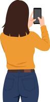 Woman with dark hair in a yellow sweater taking a selfie with a smartphone in a flat illustration vector