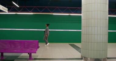 A man standing in a subway station video