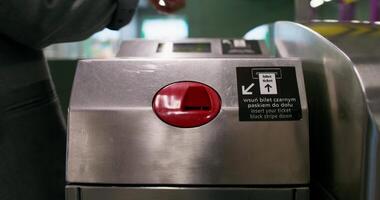 A person is using a red button on a machine video