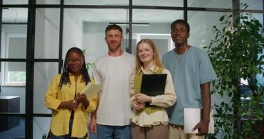 A group of people standing in front of a window video