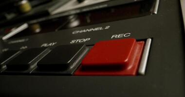 A close up of a red button on a record player video