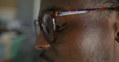 A close up of a man wearing glasses video