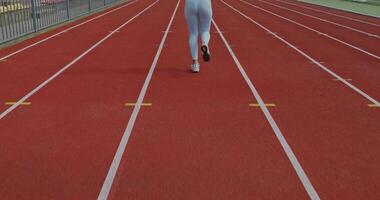A man running on a track in a game video