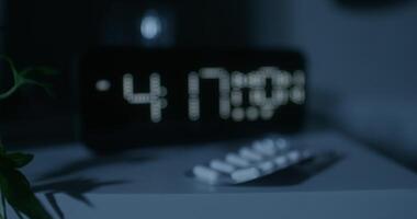 A clock with a digital display on a table video